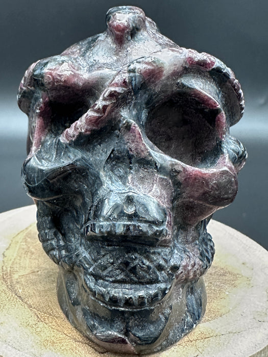 Garnet (Firework) and Astrophyllite Skull with Snake