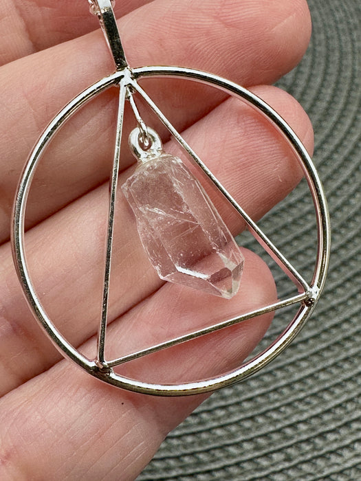 Natural Clear Quartz Point suspended within Silver Plated Inscribed Triangle on Silver Plated Chain