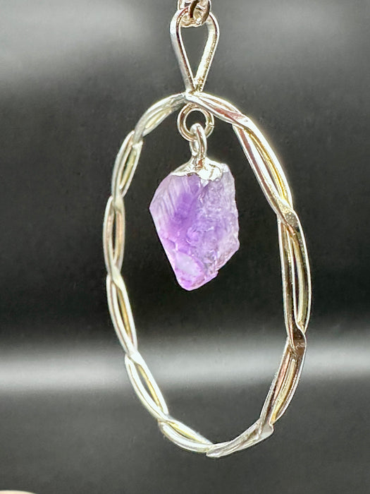 Natural Amethyst Point suspended within Silver Plated Intertwined Circle on Silver Plated Chain
