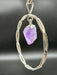 Natural Amethyst Point suspended within Silver Plated Intertwined Circle on Silver Plated Chain
